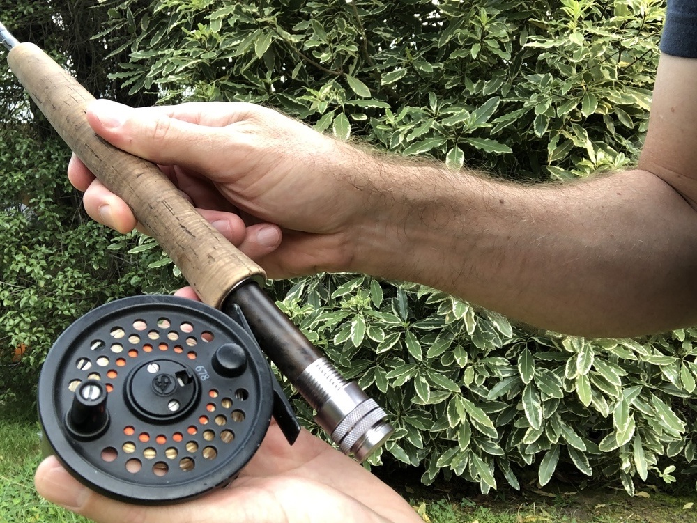Putting the fly reel on the rod.